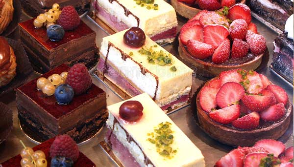 tray of delicious french bakery desserts and cakes